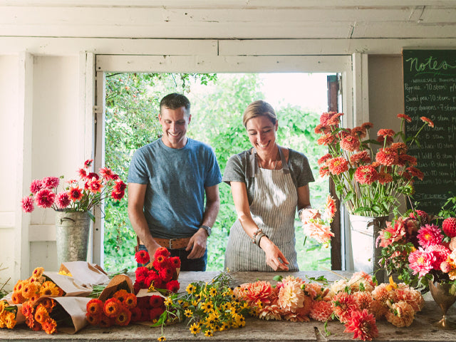 Chris and Erin Benzakein arranging flower bouquets; photo copyright Joy Prouty