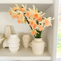 Narcissus ‘Rosy Trumpet’ arranged in a vessel.